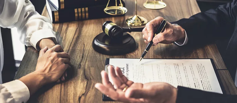 Real estate attorney sitting with client