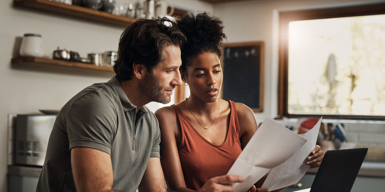 Couple looking through real estate documents