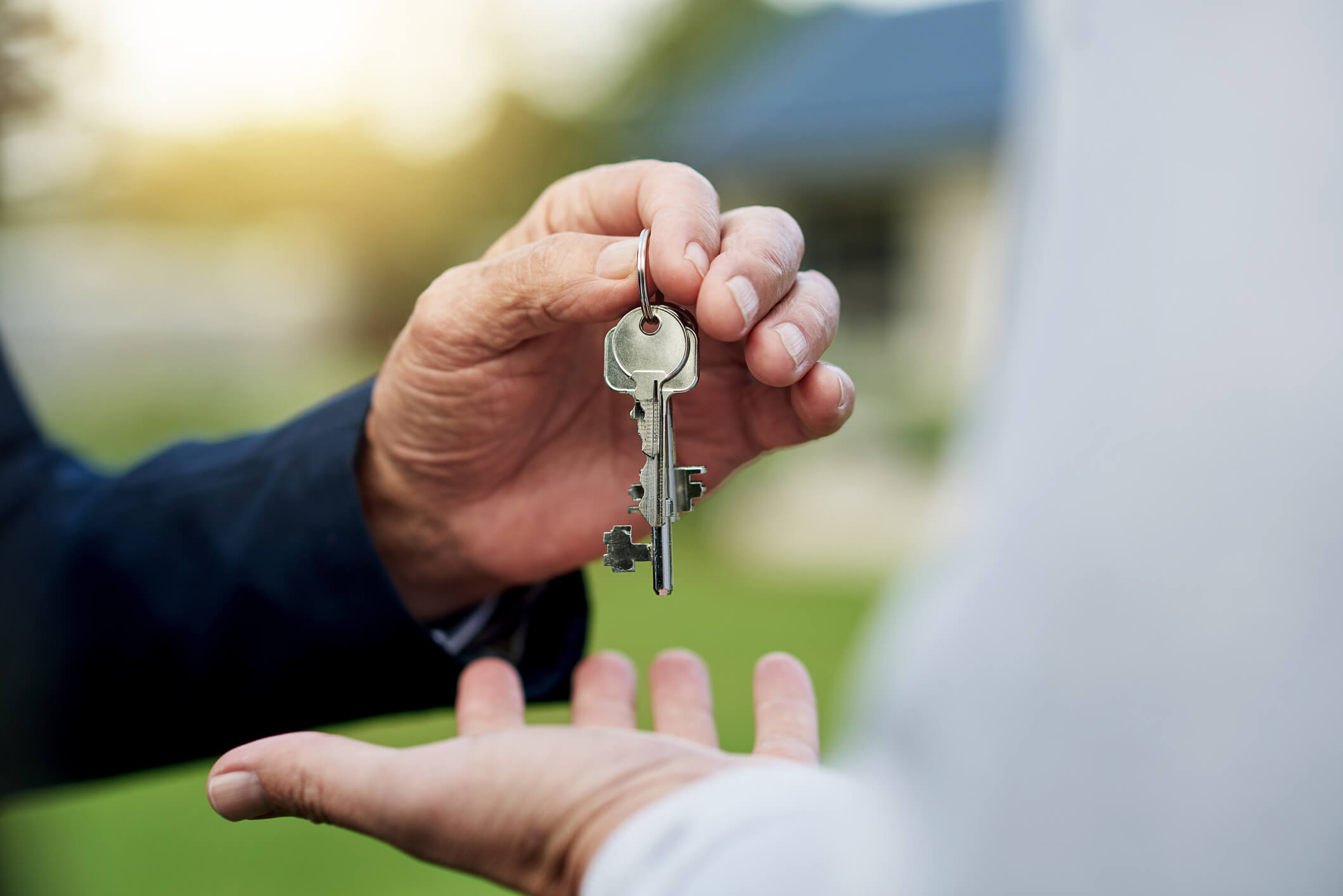 Man receiving keys for his condo