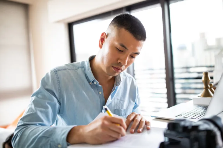 man signing insurance claim