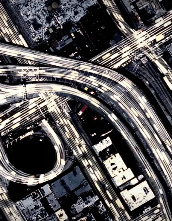 Aerial view of timelapse car lights driving on a highway