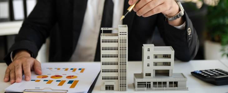 Model of apartment complex on desk.