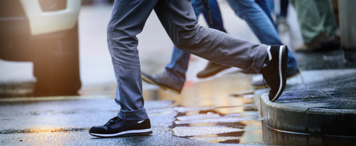 Pedestrian walking into road as car approaches